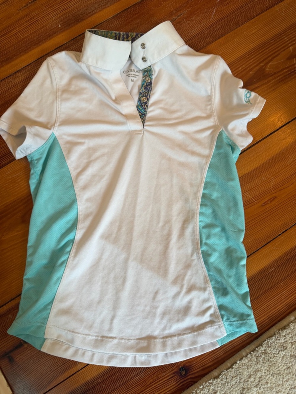 White Show Shirt with aqua detail on collar and sides. Girls size Medium.